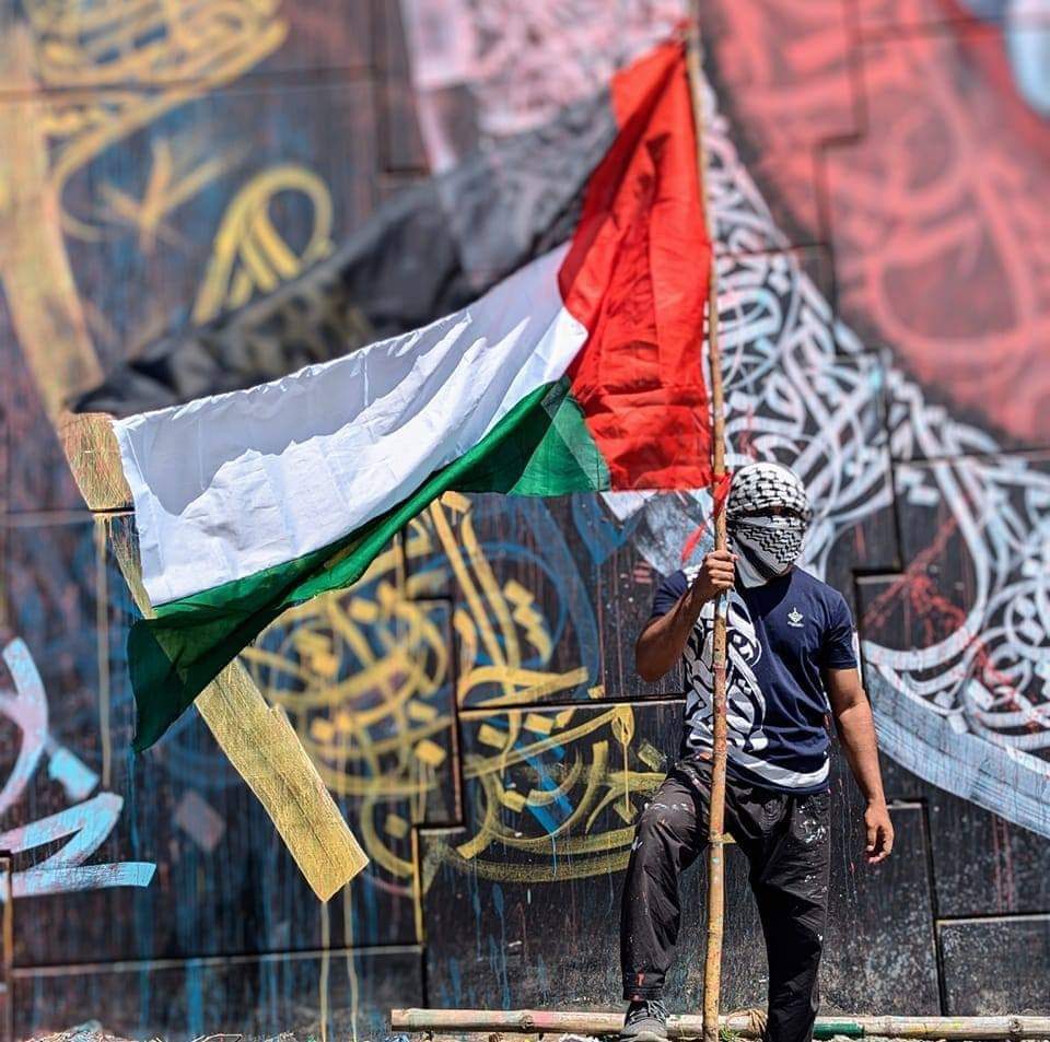 From Dhaka 
To G*a*z_a
Long live the Intifada. 

From the river
To the sea
Pa*l/e/st*ine will be free. 

InshAllah! 

Collected image.