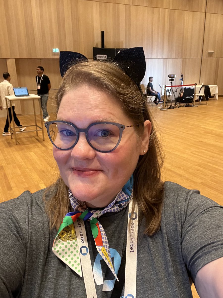 Why am I wearing cat ears you might wonder? ⁦<a href="/eze_lanza/">Eze Lanza</a>⁩ and I will be talking about Simplifying Generative AI App development at 11:55 in room 2.31 at #ossummit EU in Vienna! Come to our session and it will all make sense. 😂