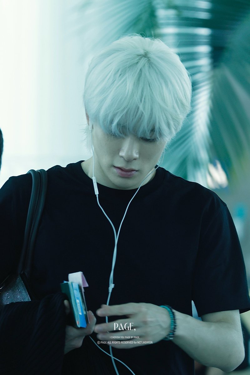 NCT's Jaehyun debuts platinum blonde hair.