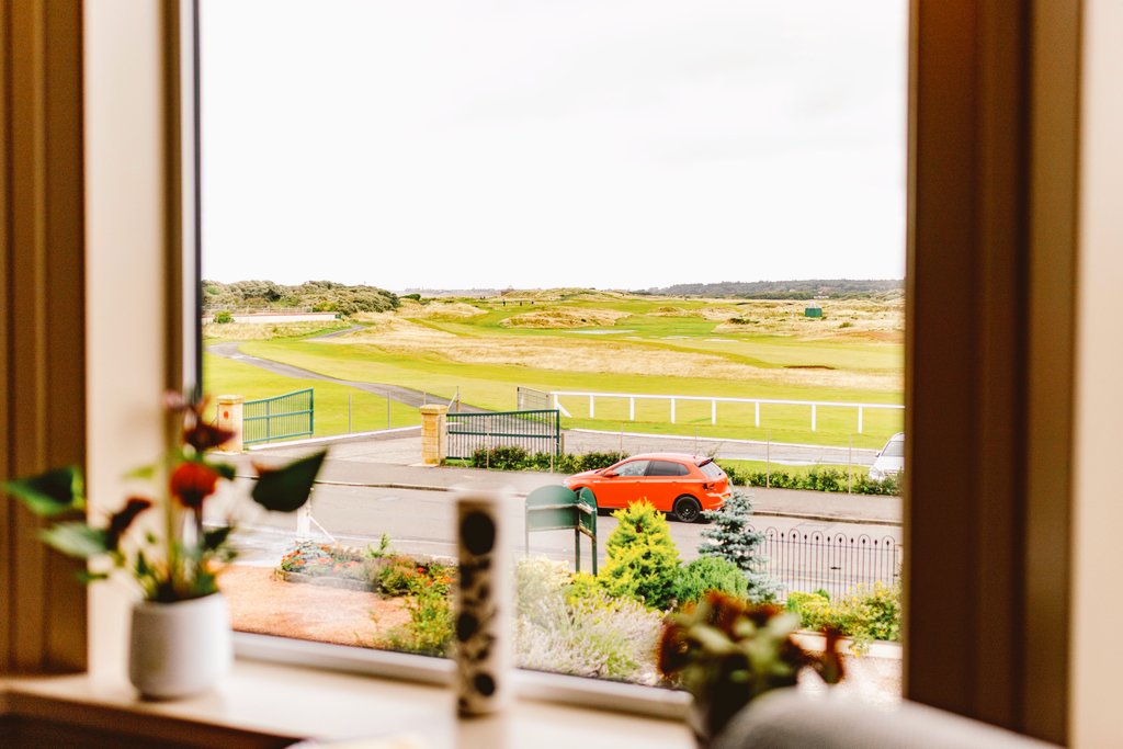 GrahamPGC1's tweet photo. Prestwick Golf Club's Dormie House lounge view. Depending on your game, it could be a 56°  wedge away from the gates !! https://t.co/2lQoELVSYZ