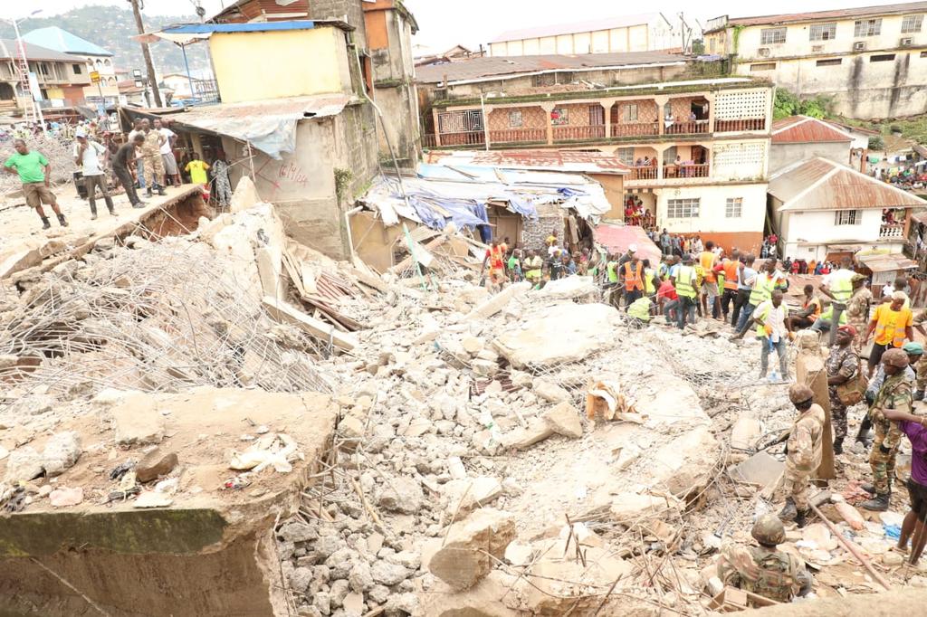 The death toll at the collapsed seven-storey building has gone up to nine; a four-month-old baby was recovered from the debris today, according to the National Disaster Management Agency. Two of the seven survivors who are in critical condition have been transferred to the