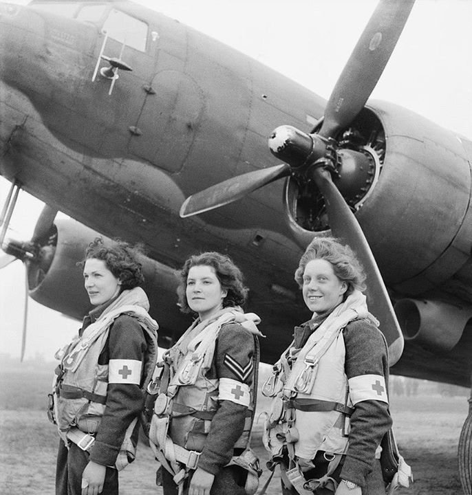 The first British WAAF orderlies, Leading Aircraftwoman Myra Roberts, Corporal Lydia Alford, and Leading Aircraftwoman Edna Birbeck selected to fly on air ambulance duties to France posing before a Dakota Mk III of No. 233 Squadron RAF at B-2 Bazenville.. in Normandie.