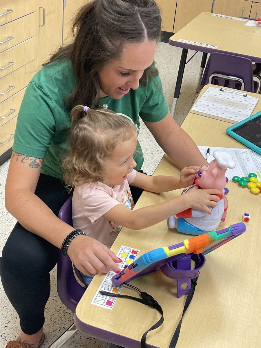 GernerCenter's tweet image. Pop the Pig was a big hit with Mrs. Frerichs’ students this afternoon. Who knew this game involved concept application, fine motor skills, play skills of taking turns and so much fun! We were all laughing!