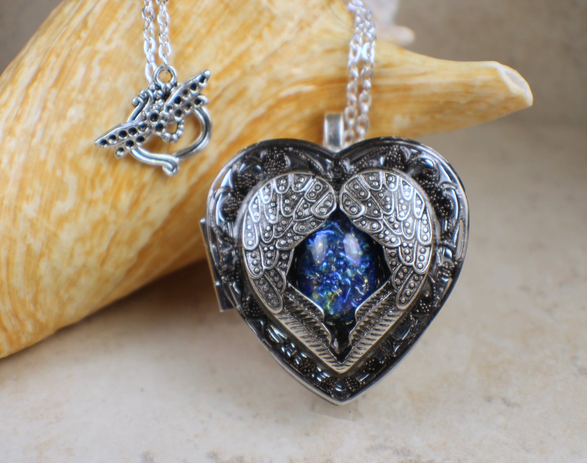 Silver Angel Wing Music Box Locket tuppu.net/f0d7d66e #Shopify #Char'sFavoriteThings #Heart_music_box