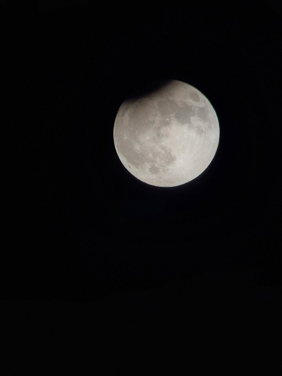 The view of the partial #LunarEclipse that just now was at its maximum depth.  Yes, just a nibble of shadow. Don't worry,  we'll get to see a total one in March.... #UCFontheMoon