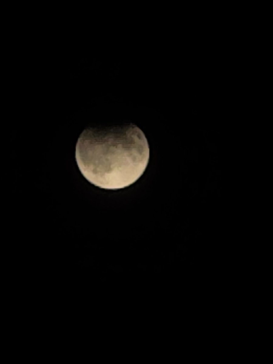 The sky agreed to allow for a beautiful display of a partial lunar eclipse.  You can see the Earth's umbra at the top and the slightly darker penumbra below.  #space #SciEd