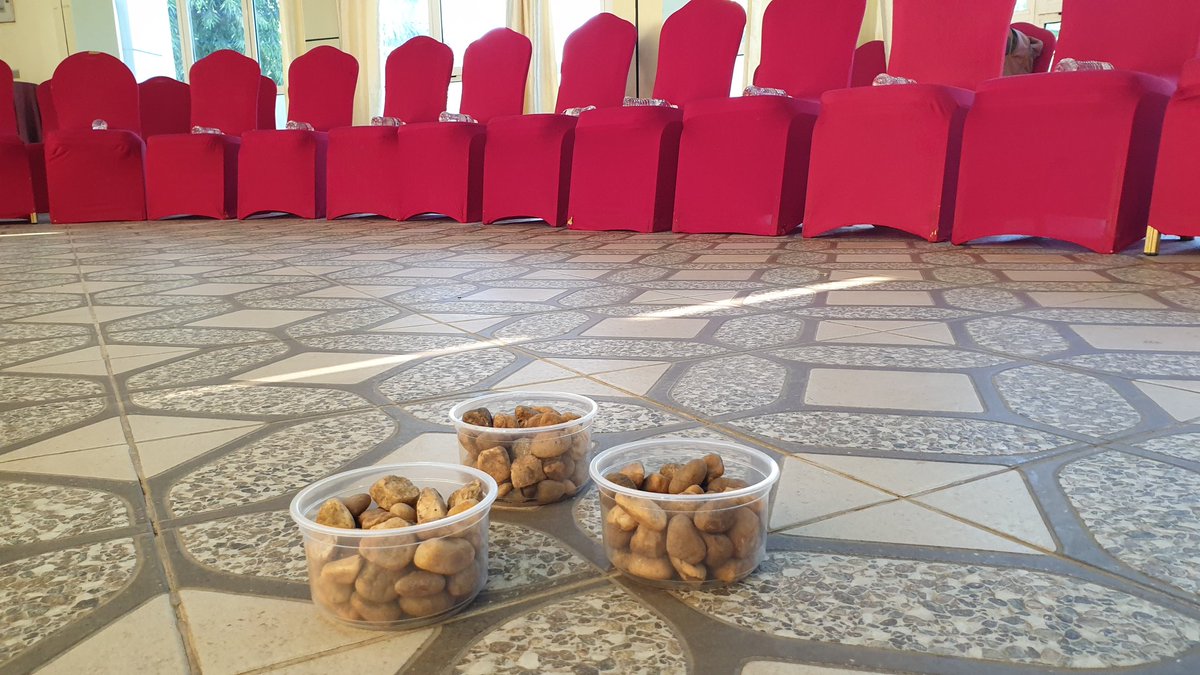 robalancaster's tweet photo. ICGS pre-planning meeting. Weird POF facilitation tools. Random containers of stones on the floor waiting for delegates to arrive... ??? @RSRTFSouthSudan @POFSouthSudan #ssot https://t.co/5BLdNVUi6i
