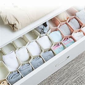Use dividers or small boxes to separate socks, underwear, and accessories in drawers. Roll clothes instead of folding to save space and stay organized. 

#DrawerOrganizers #ClothingStorage #DrawerDividers #SockOrganization #UnderwearStorage #AccessoryStorage #OrganizedDrawers