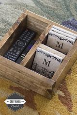 Use a tray on the coffee table to keep remotes, magazines, and coasters organized. Velcro remotes to the couch or table side for easy access and to avoid losing them.

#RemoteControlHolder #LivingRoomOrganization #RemoteStorage #CoffeeTableTray #CorralRemotes #Organized