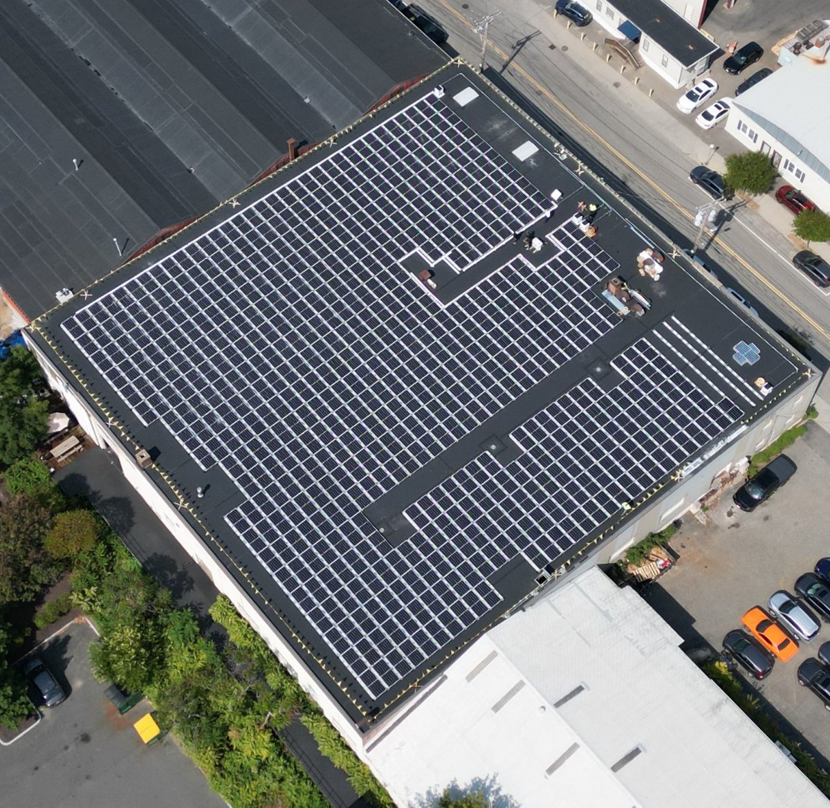 That’s how you cover a roof with solar panels! <a href="/Harvard/">Harvard University</a> University project moving into the AC side of the construction. Inverters down, conduit starting.