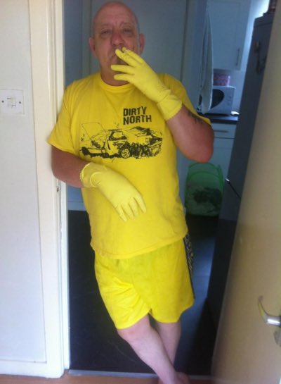 Photograph
Steve Shy, Dirty North, Deb Z
2012

Steve Shy enjoying a cig break at home in Fallowfield, in his Dirty North t-shirt and marigolds.
Circa 2012.
Photo credit to Deb Z.
Added 15th May 2023 by yvw

#steveshy