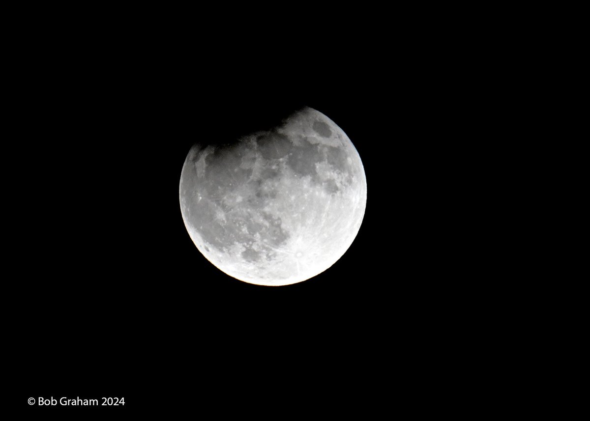 Last night's harvest moon with a partial eclipse, seen from San Diego, CA.