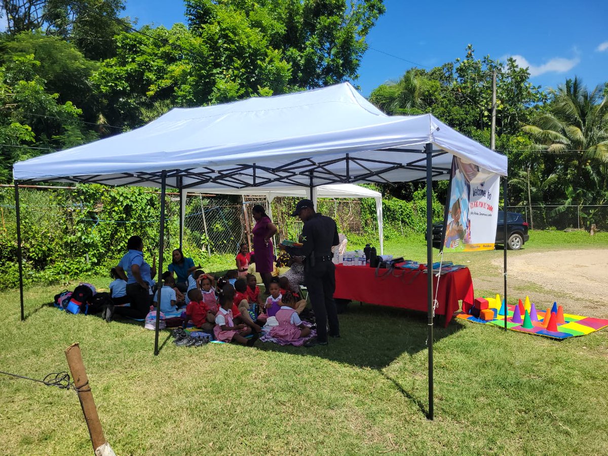 Constable Clarke from <a href="/JamaicaConstab/">Jamaica Constabulary Force</a> reading to students at #ECCReadPondiCawna in Wakefield today!
<a href="/ECCJA/">Early Childhood Commission</a> 
#12StandardsMatter #ReadingMatters