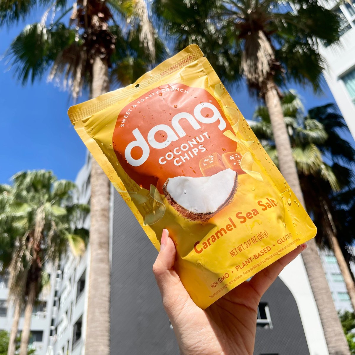 🌅 Sun-Kissed &amp; Crispy! 🌴 Enjoy Dang Coconut Chips Caramel Sea Salt under the sun. With 50% less sugar than apple chips, they’re the perfect crunchy treat for sunny days! 🥥✨

#dangfoods  #healthysnacks
