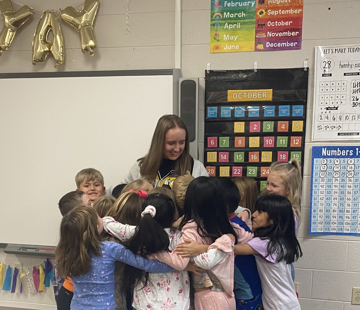 PDS student, Amy Sue Tish, is saying goodbye to her 1st grade students in Ms. Magen Wood's class at Murray Elementary School.  She will be moving to 4th grade to finish her practicum semester.  These students are excited, though, that she will be back with them next semester.