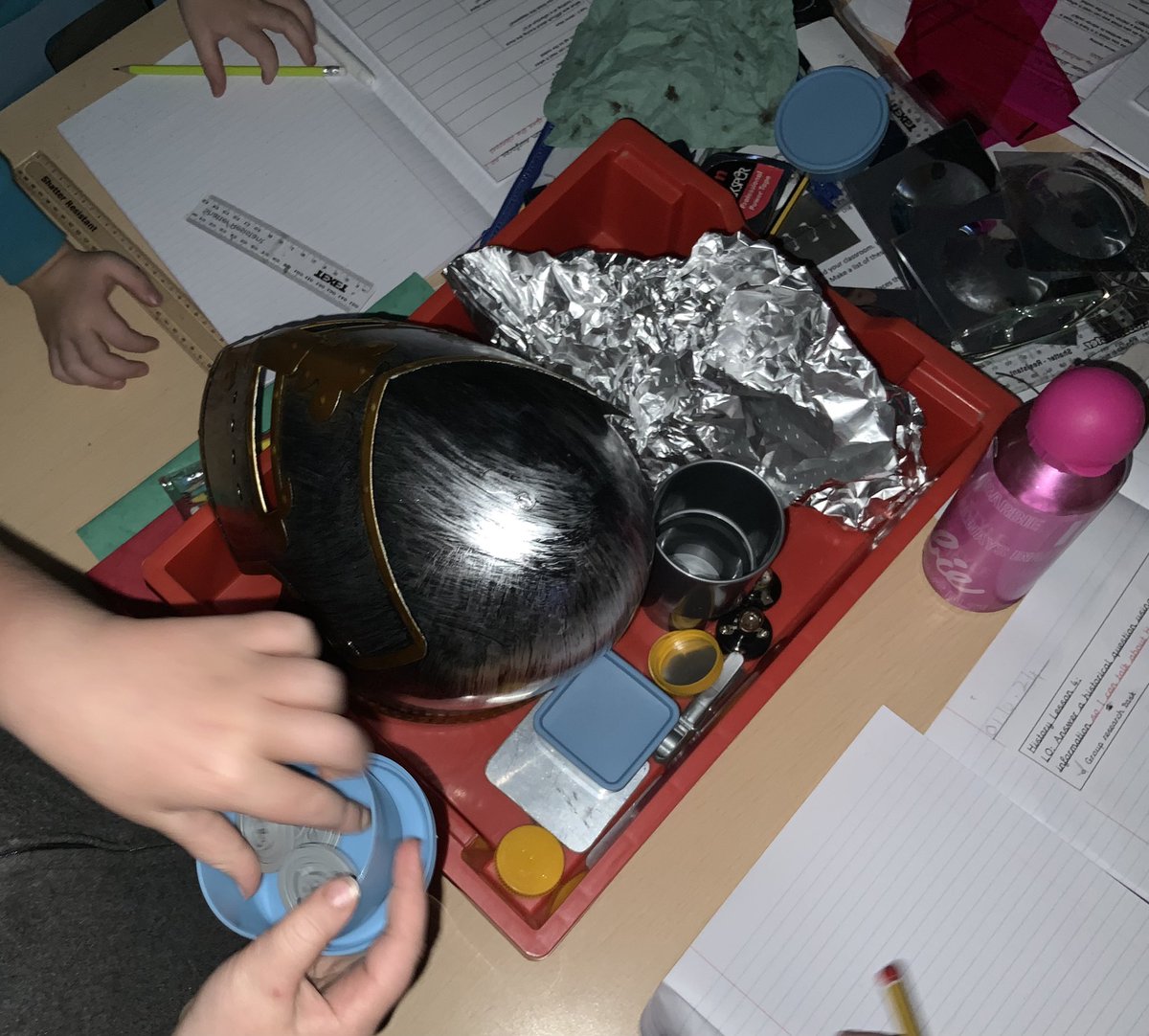 Activity 3- tape together two mirrors and see if you can make more than one reflection. The pencil kept multiplying! And finally, the children investigated a group of silver/grey objects to see which materials were best for reflection. Some funny results in the curved ones.