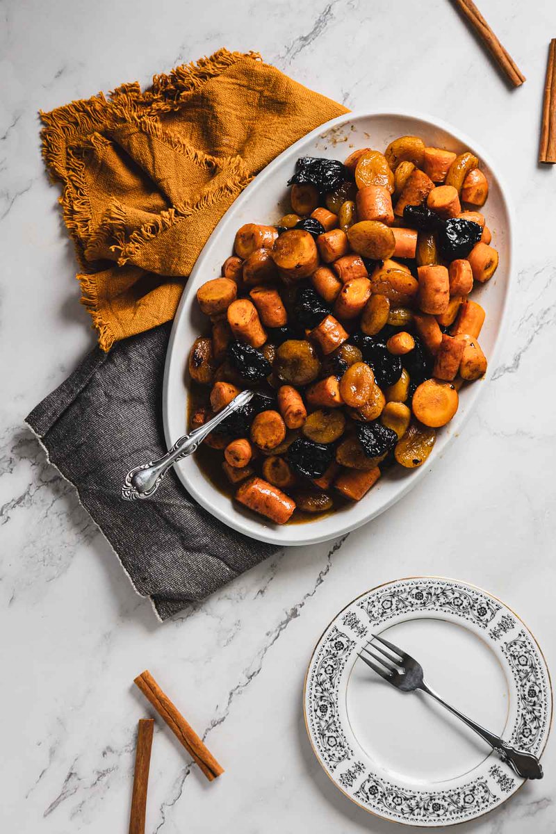 My grandmother's classic Russian Jewish Carrot Tzimmes! 🥕✨ Packed with carrots, prunes, and honey - a comforting holiday dish. Full recipe at immigrantstable.com #RussianJewishFood #tzimmes #RoshHashana #vegetarian