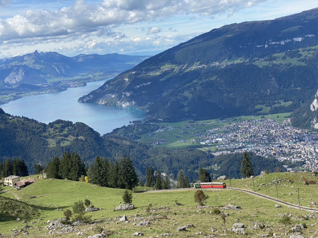 meedya's tweet photo. The snow-capped Eiger, Mönch &amp; Jungfrau peaks tower over the dinky cog railway that rumbles up from Wilderswil to Schynige Platte. Gorgeous hikes up here, hotel and restaurant, but it all closes for the winter on 20 Oct. My lovely sister and friend Marion brought the sun https://t.co/iAO70YTyud