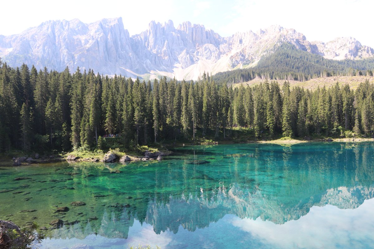TimmyfatB's tweet photo. Lake Carezza is a small alpine lake located at 1534 m in the upper Val d'Ega in the municipality of Nova Levante, about 25 km from Bolzano in Alto Adige, nestled between thick fir forests, under the slopes of the Latemar massif, which is reflected in its clear water.

.. https://t.co/M2OWsO3VRr