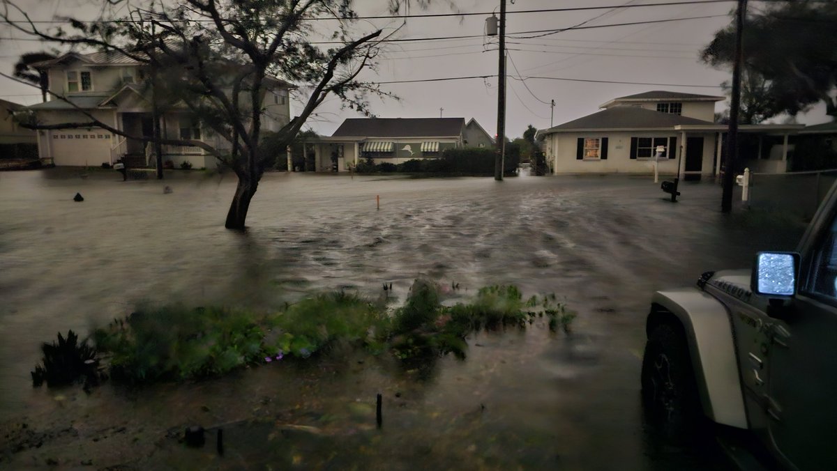King_INF3RN0's tweet photo. Long exposure in the middle of the night last Thursday of the flood waters from a 6ft storm surge right before we left our home at 9:15pm or so. It still came up 27 inches into the house. We lost almost everything and only today are we finally getting the majority of what's left out. 
There are a lot of people in the Tampa Bay area hurting with how much damage we have to deal with. Multiple tens of billions of dollars I'd assume just within 10 miles of me. The water was indiscriminate.