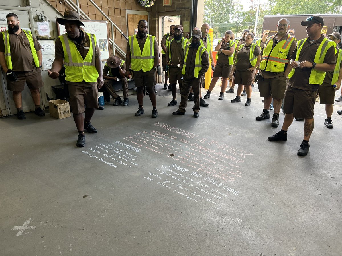 UPSManJohn's tweet photo. If it’s Tuesday, it’s time for our #GuardGateActivity and Calvin is talking about our power zone and being like a T-Rex. Your power zone runs from your mid thigh to your mid chest and works best when you keep what you are carrying close to you, like a T-Rex!! 🦖 https://t.co/oQJc1qP2OP