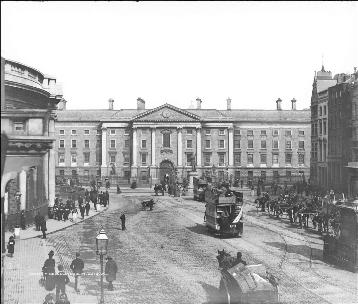 Trinity College and College Green in Dublin with horses and trams on the main thoroughfare. Photo: William Lawrence c. 1890