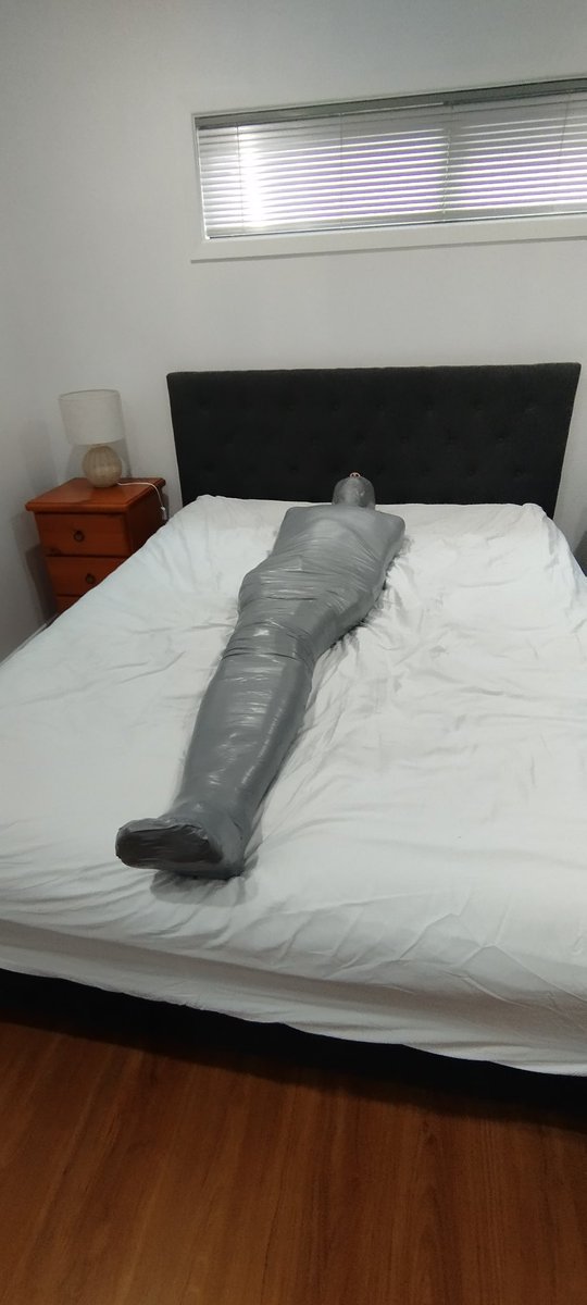 ezyves1's tweet photo. I sure do love being mummified in tape, and @Xylon_NZ is just the man for the job. He had me tightly bound for hours, all I could do was wriggle and wonder what he was going to do with me next. https://t.co/XkB4HVk4GD