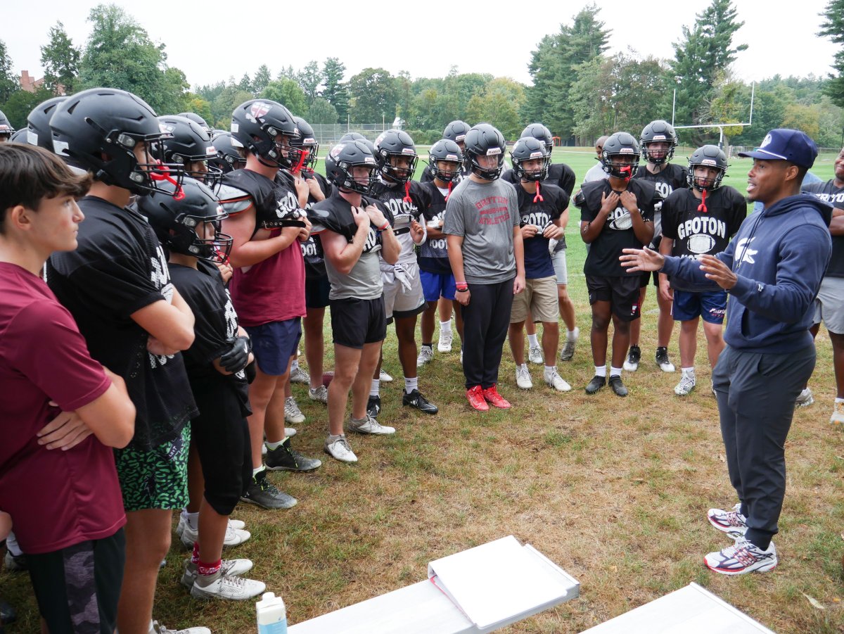 GrotonSchool's tweet photo. New England Patriots defensive back and punt returner Marcus Jones surprised the Groton football team Friday at the start of practice with an informal get-together and Q&amp;A session. https://t.co/wKwCck5RDp
