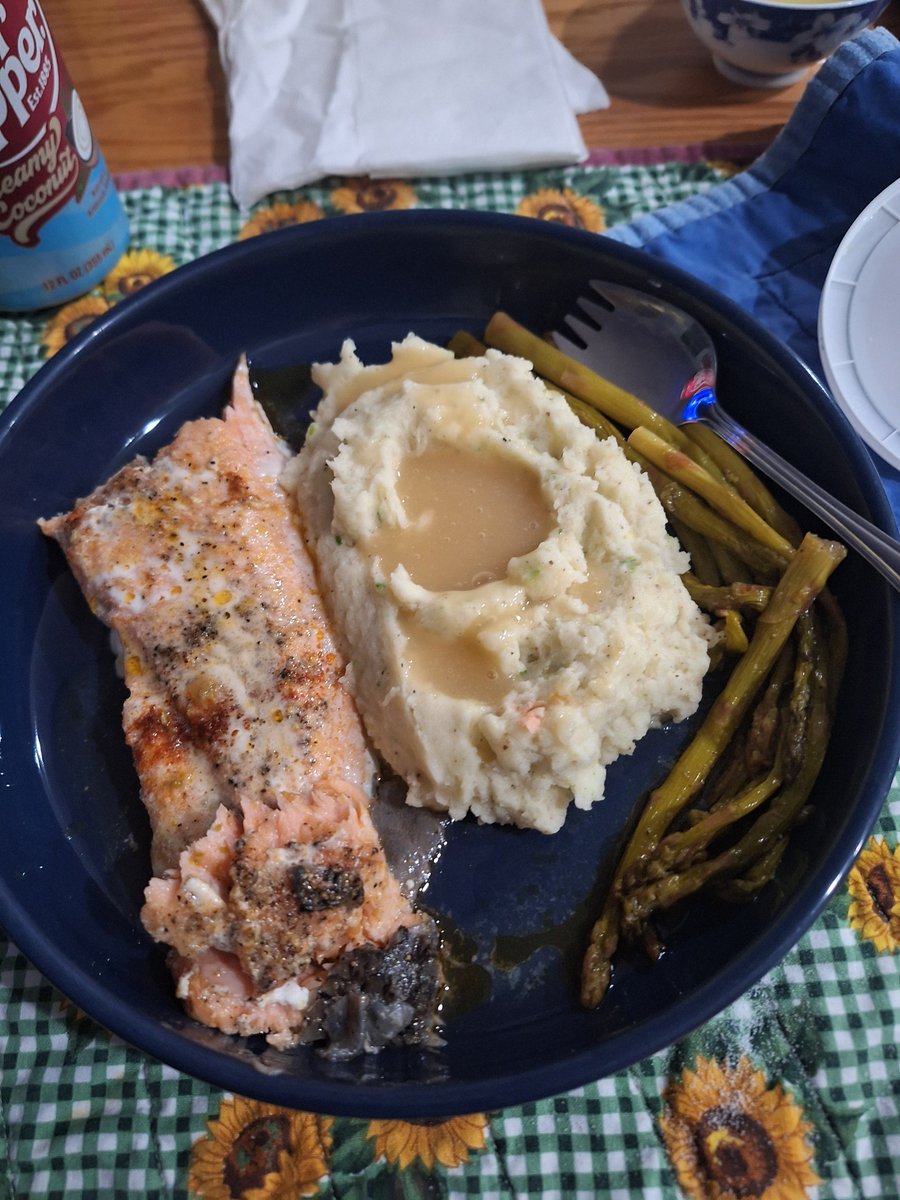Butter poached salmon, leek mashed potatoes, poultry gravy, and pan fried asparagus