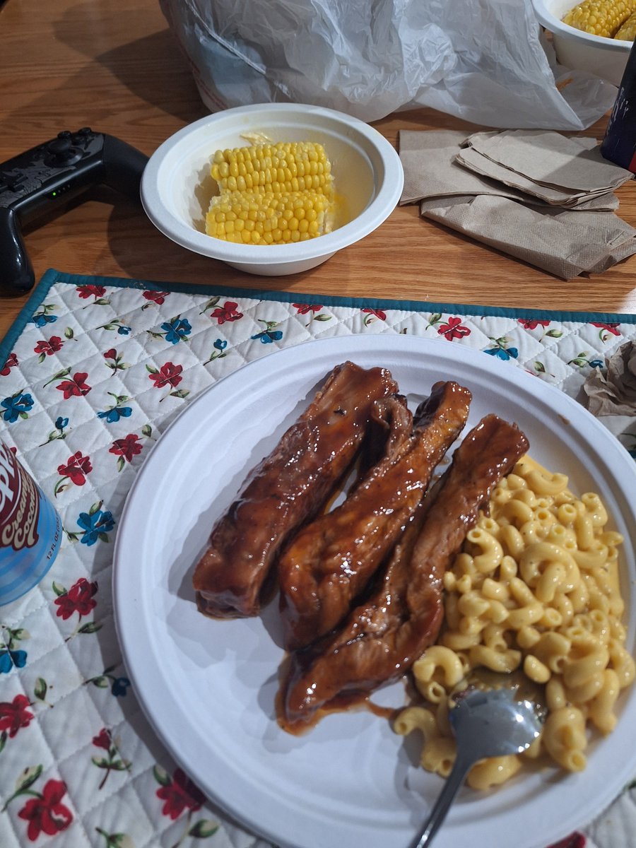 BBQ pork ribs, mac and cheese, and corn, the drink is Coconut Dr