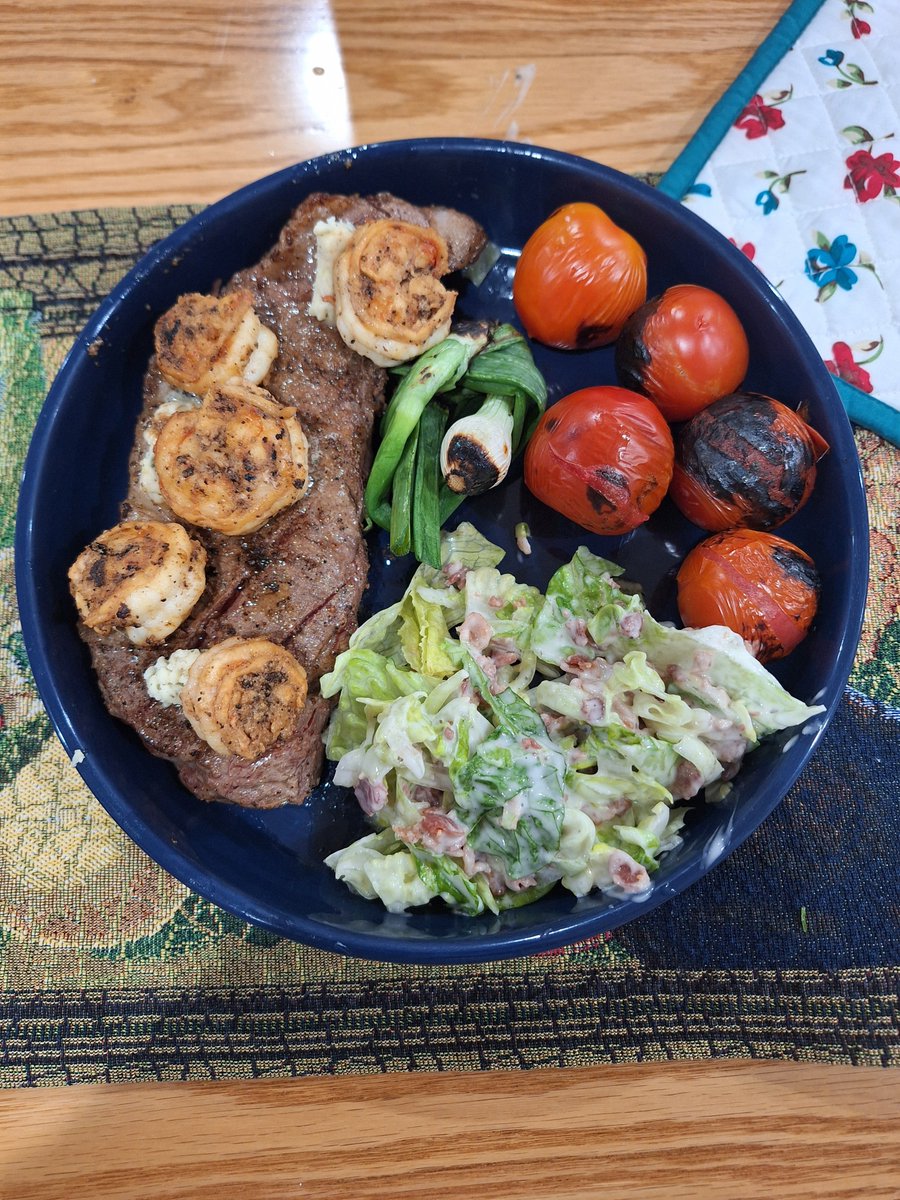 Rare NY strip steak, large gulf shrimps, blistered campari tomatoes, fire roasted large green onion, side salad of romane hearts dressed lightly with parmesan ranch  and bacon