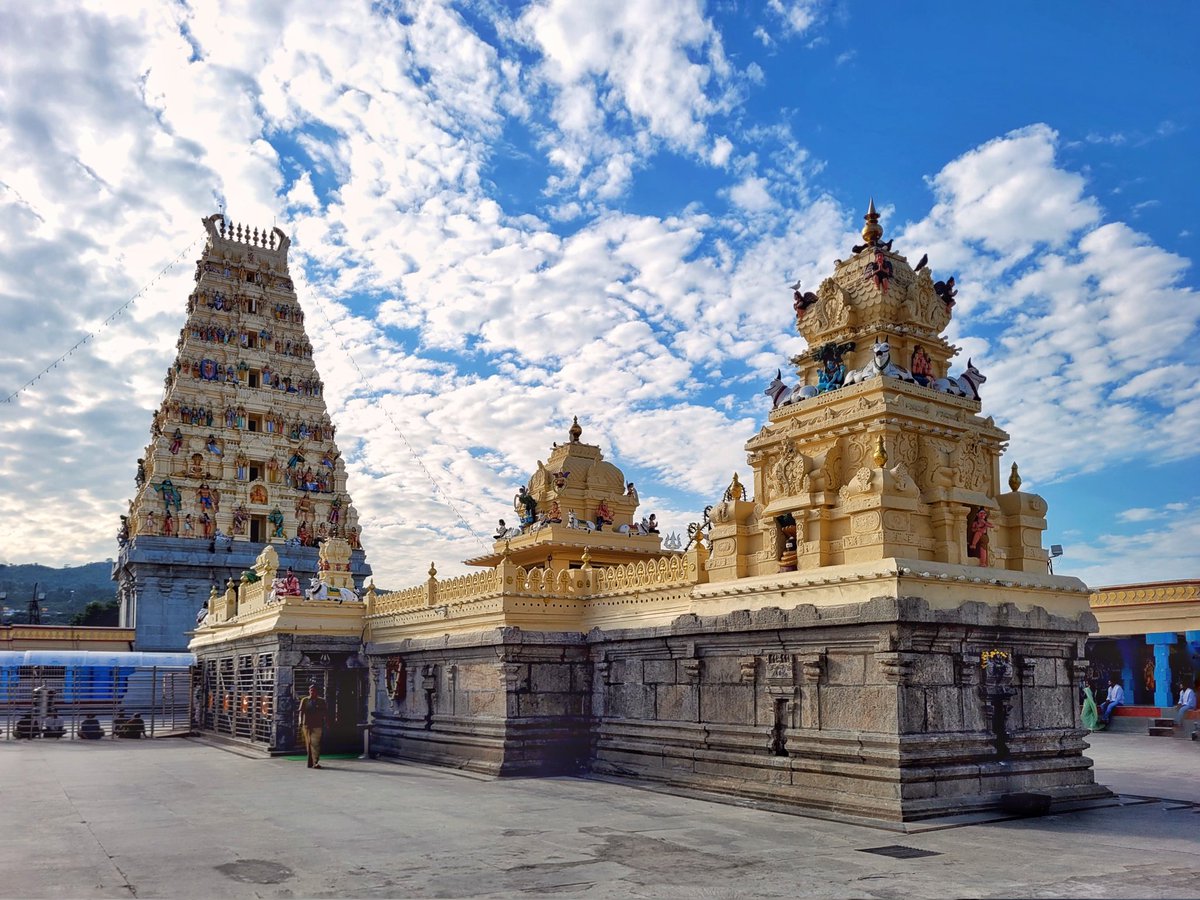 Taarikhnama's tweet photo. Situated in the serene Male Mahadeshwara Betta of Karnataka, the Male Mahadeshwara Temple stands 3,000 feet high. Built in Dravidian style with stone-carved pillars, a Nandhi statue, and a sacred tank, it’s a spiritual haven for pilgrims and a natural retreat for nature lovers. https://t.co/EFusGIEIvQ
