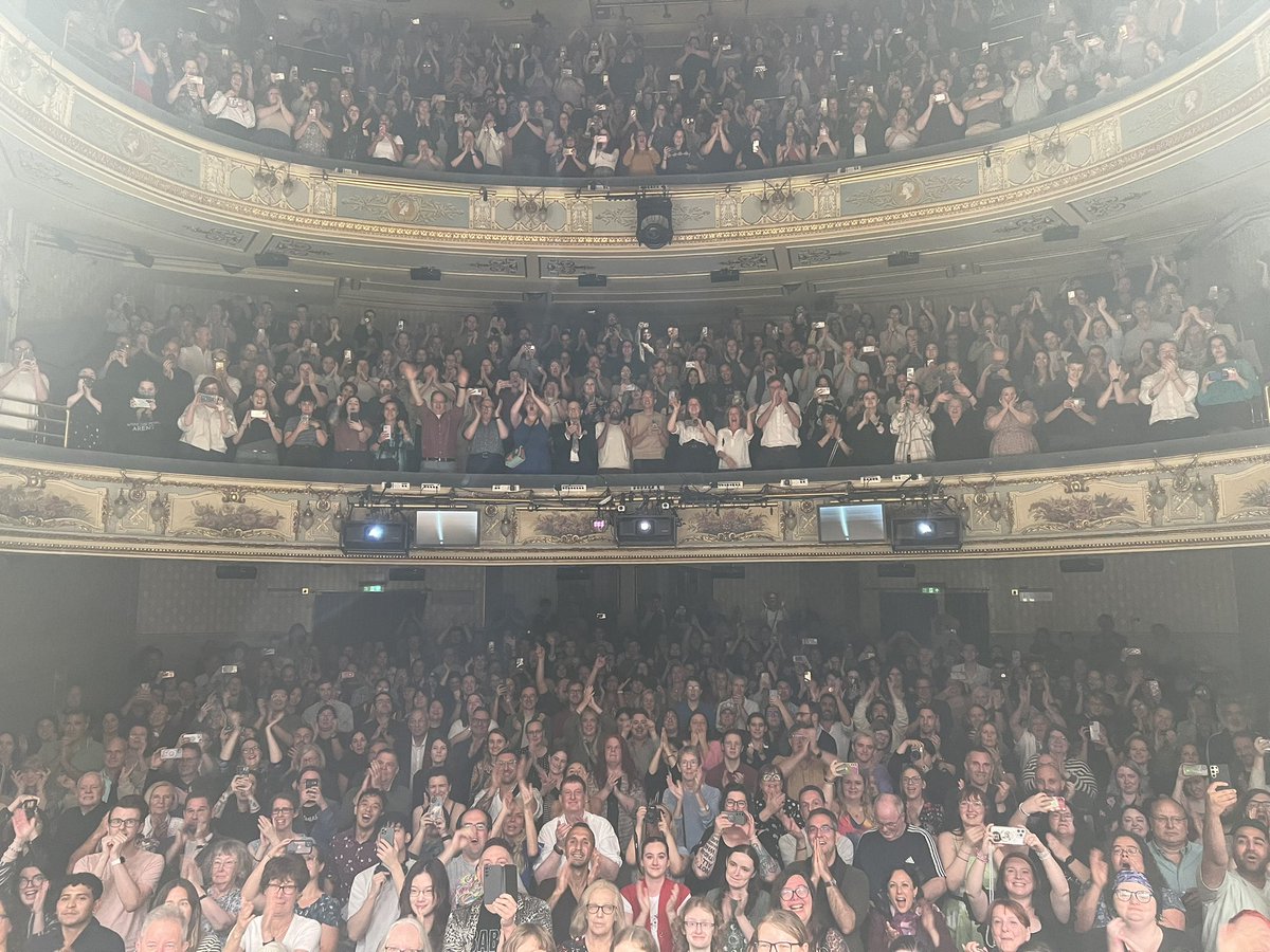 Look at all these people with their phones out at the theatre. Terrible behaviour.