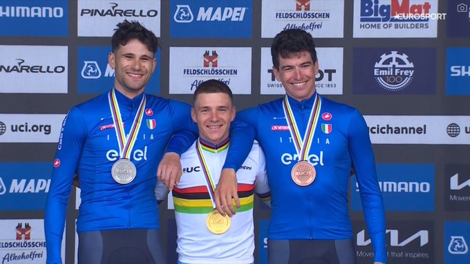 DanDeakins's tweet photo. Remco picking up Ganna and Affini on the podium. They don't call him the Muscles from Brussels for no reason https://t.co/ihjJcD2NBW