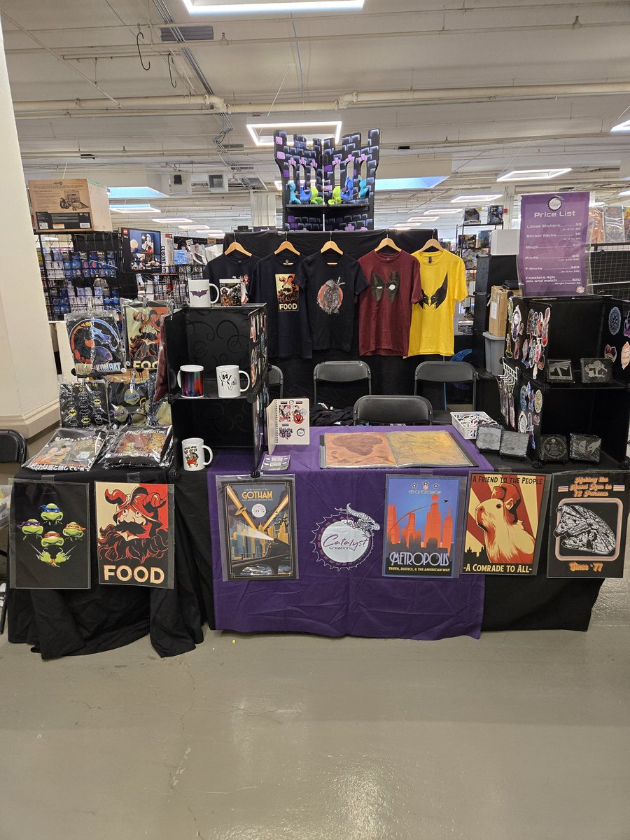 CatalystCrafts's tweet photo. We sold out of several of shirts and prints before noon yesterday, so we went back to the shop and made a whole bunch more. Come by @granitestatecomicon today before they are gone again! #lastronin #hazbinhotel #deadpoolandwolverine #granitestatecomiccon #deliciousindungeon #graphictees #handmade
