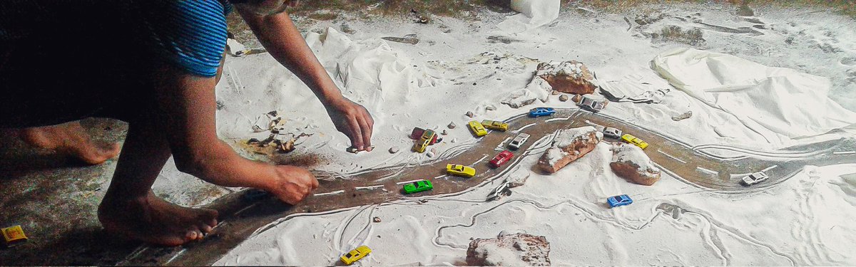 Percy_Maimela_'s tweet image. I create a snow scene using salt, rocks and toy cars.