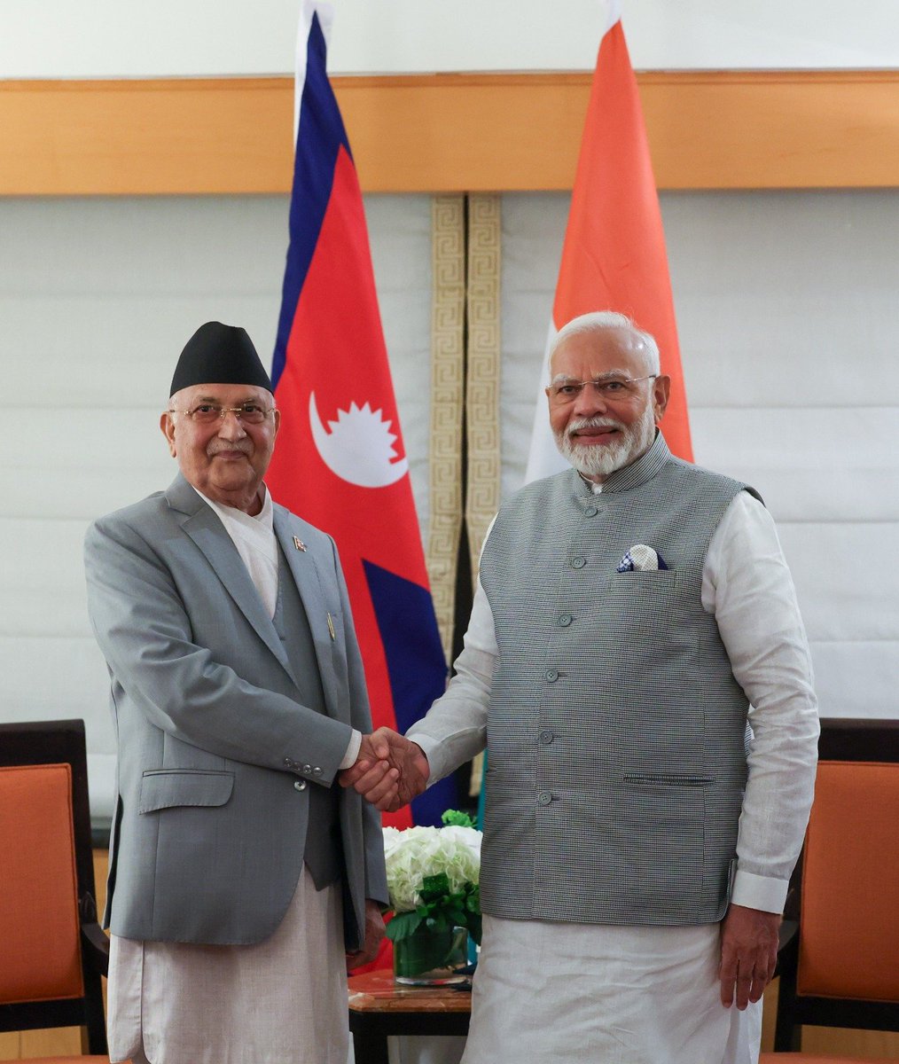 narendramodi's tweet photo. Had a very good meeting with Prime Minister KP Oli in New York. The India-Nepal friendship is very robust and we look forward to adding even more momentum to our ties. Our talks focused on issues such as energy, technology and trade. @kpsharmaoli https://t.co/WGrSrL8mEO