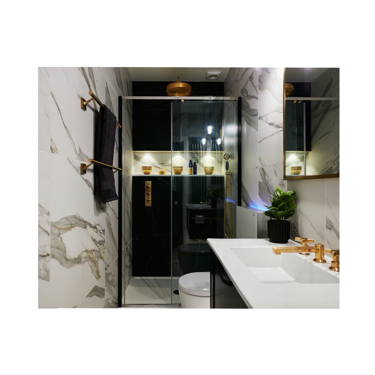 Bathroomeleven's tweet photo. Our clients were after a statement bathroom with a luxury hotel feel, with the look of natural materials such as marble and gold. Creating a striking and elegant look, using white marble effect tiles throughout the main part of the room, contrasting with black tiles in the shower https://t.co/c8sOHdfPq8