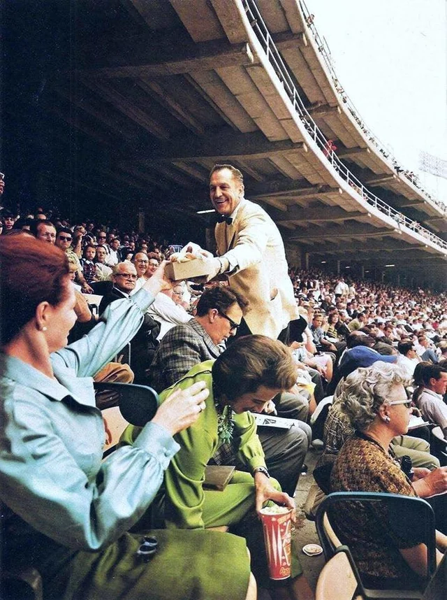 NO. Vincent Price handing out hotdogs is.
