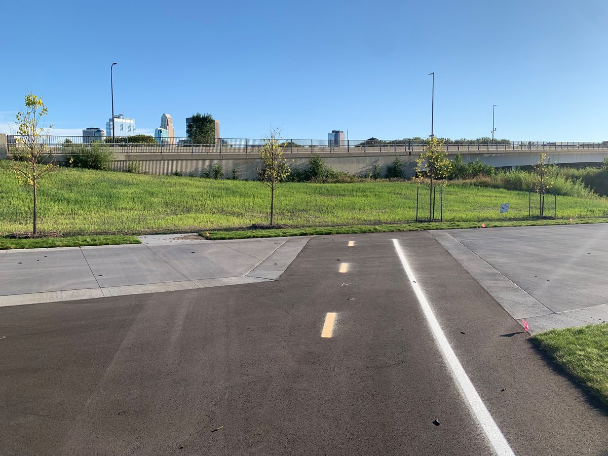 urbanevesen's tweet photo. I know Hall Island isn’t finished yet, but this is very funny to me. 

Also how did our bike rack designs regress? Does Minneapolis not have standardized street element design? https://t.co/Scuva74kJ4
