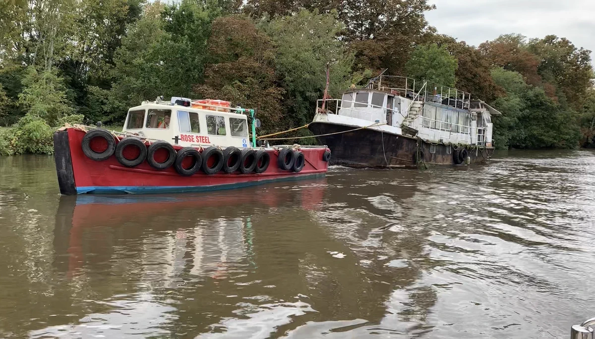 Barge being towed