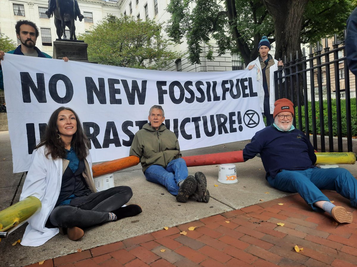 XRBoston's tweet photo. We're Baaaaack! Extinction Rebellion activists have locked onto the gates of the Massachusetts State House to demand No New Fossil Fuel Infrastructure in the Commonwealth -- a reprise of Monday's call for action https://t.co/BBnz6ozKGv