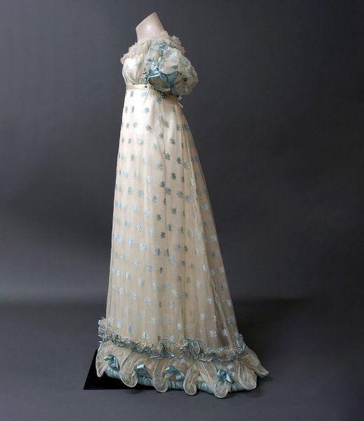 Gorgeous Regency evening dress. Can we see any of our literary ladies  wearing this?  1820-1822, England. Silk gauze with a woven pattern of  blue leaves in flossed silk, trimmed with silk