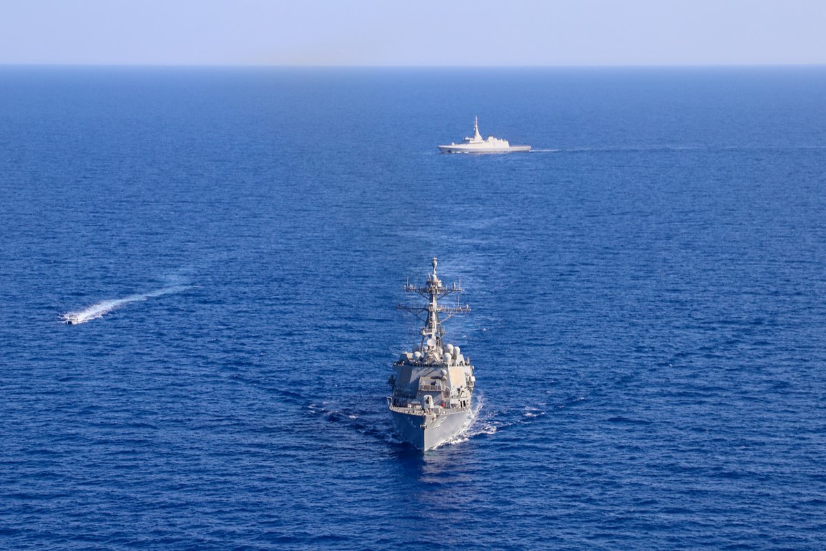 DeptofWar's tweet photo. During exercise Eagle Defender 24, the #USSMichaelMurphy sails alongside the Egyptian navy. This bilateral exercise is designed to enhance interoperability and allows participating naval forces the opportunity to develop the necessary skills to address regional security threats. https://t.co/7XajsQuy1H