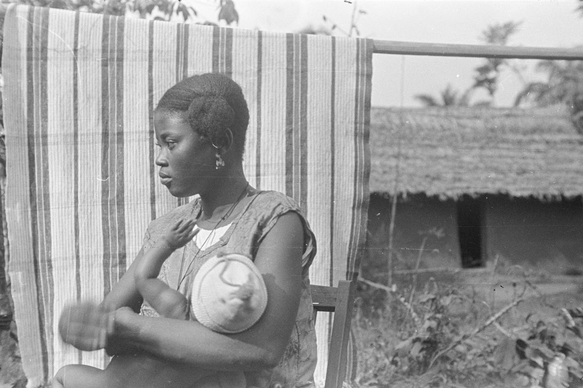 c.1930-1939 - Young Igbo woman and her child, photographed in the eastern region of Nigeria.