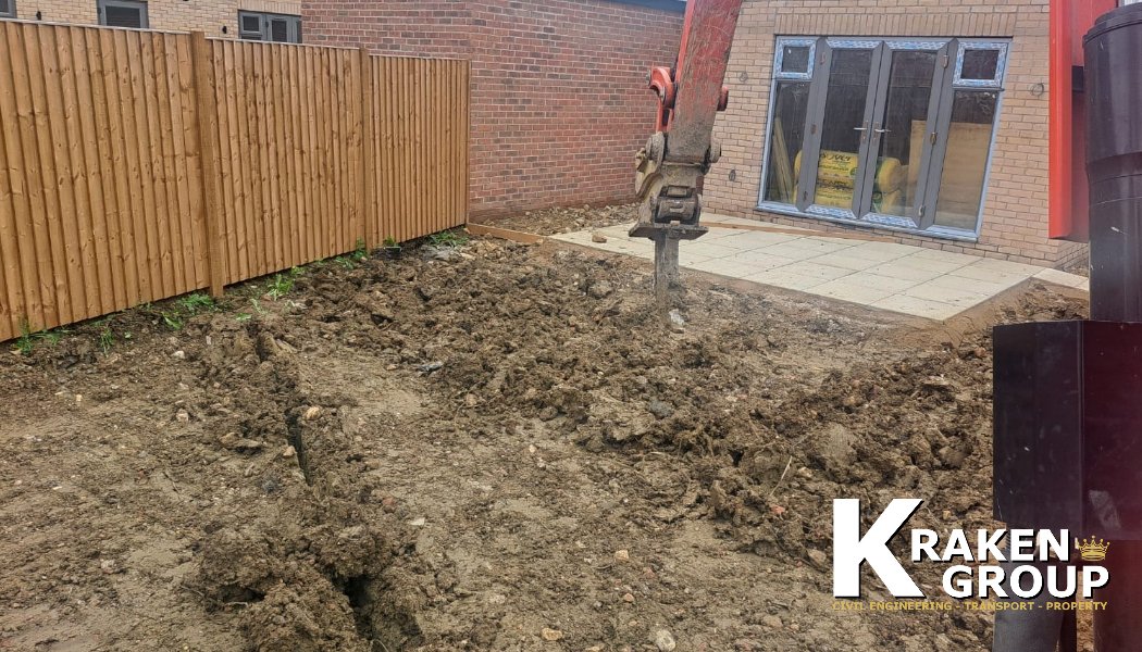 GroupKraken's tweet photo. This week, our team has been hard at work breaking up the clay soil to prepare for topsoiling in the back gardens of the newly built houses. We utilized the ripper tooth followed by the tooth bucket to transform the soil into a finer texture. https://t.co/9JQJF70Zkt