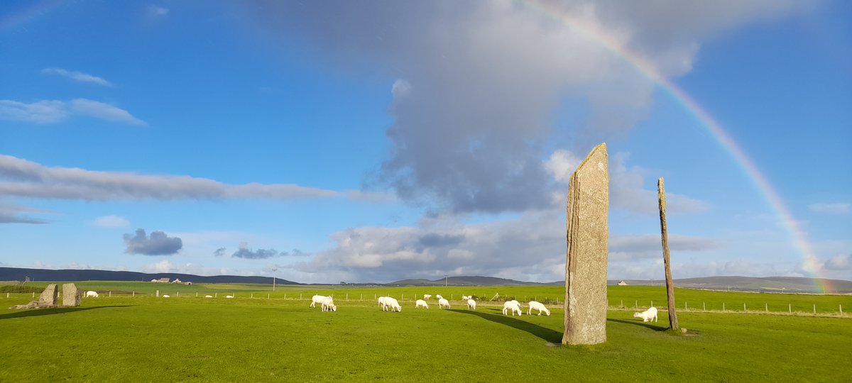 JudithJesch's tweet photo. Composition with rainbow, stones, sheep, mound (can you make out #Maeshowe in the distance? #Orkney https://t.co/cgwzSwHqZz