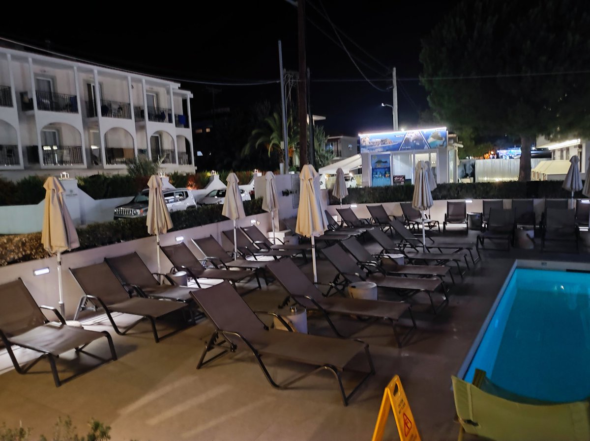 dandomino1's tweet photo. @TheLordBlaidd GOT a creepy feeling the hotel Im staying at in Greece is a Cthulu cult after noticing the sun umbrellas at night time. https://t.co/kEnEXgo94L