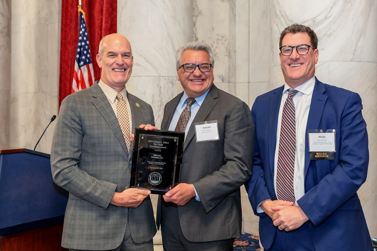 AHTCCoalition's tweet photo. .@RepRickLarson applauds the work of Millworks Family Housing, recipient of the #Edsons2024 Award in the Small Metro Category that provides 83 energy-efficient affordable homes in Bellingham, Washington. w/Ismael Guerrero @MercyHousing &amp; Matt Josephs @LISC_HQ. #AHTCCFallMeeting https://t.co/E6yHK8qizW