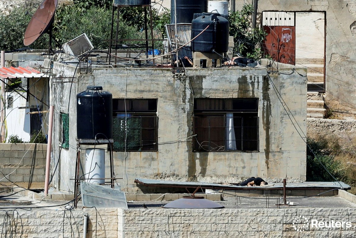 raneensawafta's tweet photo. Bodies of three #Palestinians killed during an #Israeli_raid lie on rooftops, in #Qabatiya, near #Jenin, in the Israeli-occupied West Bank, September 19, 2024. REUTERS/Raneen Sawafta https://t.co/nqf2DracWt
